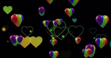 Siyah arka planda gökkuşağı kalplerinin animasyonu. Gurur ayı, lgbtq, insan hakları ve eşitlik kavramı dijital olarak oluşturulmuş video.