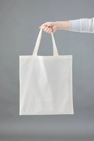 Hand Caucasian Woman Holding White Canvas Bag Copy Space Grey — Stock Photo, Image
