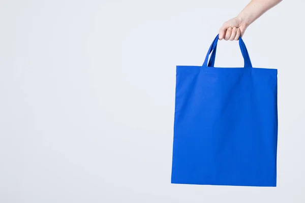 Hand Caucasian Woman Holding Blue Canvas Bag Copy Space White — Stock Photo, Image