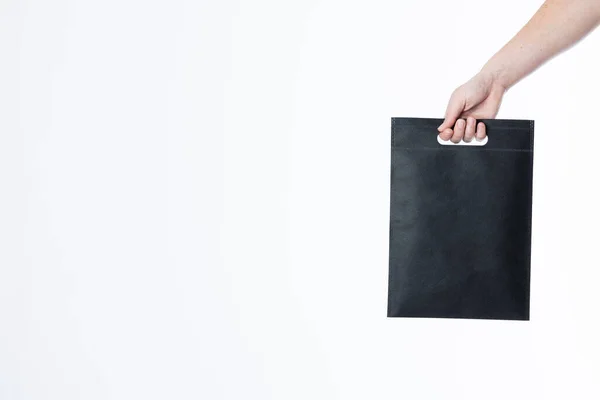 Hand Caucasian Woman Holding Black Bag Copy Space White Background — Stock Photo, Image