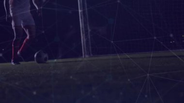Futbolcunun yerde futbolla oynayan alçak kesiminin üzerindeki noktaların animasyonu. Dijital bileşik, çoklu pozlama, iletişim, spor, soyut ve rekabet kavramı.