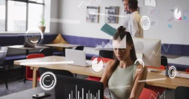 Animation of financial data processing over diverse business people in office. Global business, finances, computing and data processing concept digitally generated video.