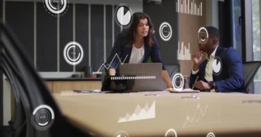 Animation of financial data processing over diverse business people in office. Global business, finances, computing and data processing concept digitally generated video.