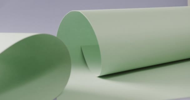 Close Two Pale Green White Rolled Papers Blue Background Copy — Stock Video