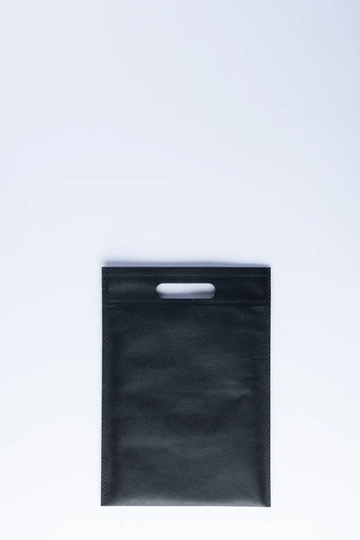 Hoge Hoek Weergave Van Zwarte Tas Met Kopieerruimte Witte Achtergrond — Stockfoto