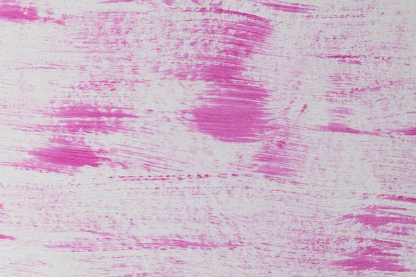 Close up of pink paint shapes on white background with copy space. Abstract background, pattern and colour.
