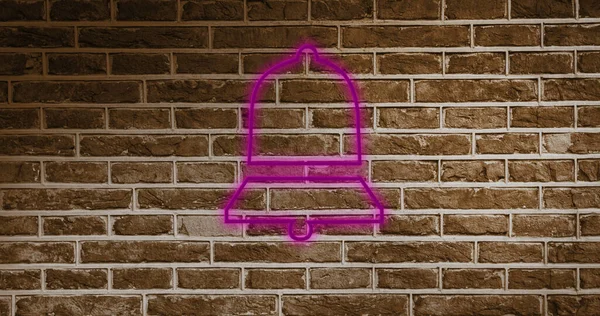 Image of pink neon bell icon on brick background. Social media and digital interface concept digitally generated image.