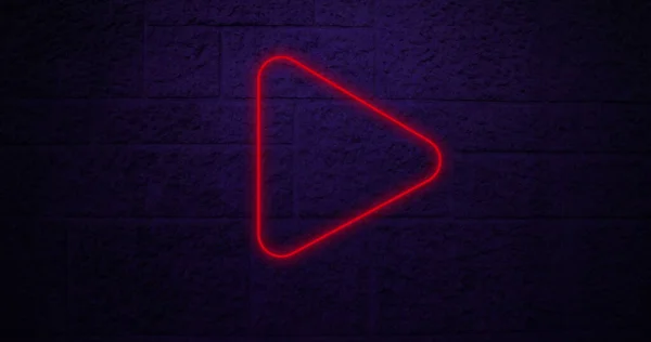 Image of red neon arrow icon on brick background. Social media and digital interface concept digitally generated image.