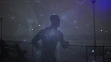 Sahilde koşan Afrikalı Amerikalı bir adam üzerinden bağlantı ağının animasyonu. Küresel iş, spor ve dijital arayüz kavramı dijital olarak oluşturulmuş video.