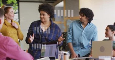 Animation of financial data processing over diverse business people in office. Global business, finances, computing and data processing concept digitally generated video.