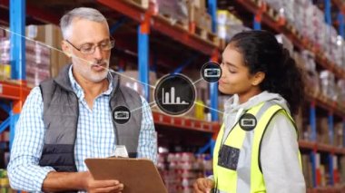 Animation of network of icons over diverse male supervisor and female worker discussing at warehouse. Global networking and logistics business technology concept