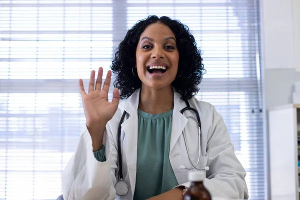 Happy Biracial Female Doctor Sitting Desk Having Video Call Doctor — Stock Photo, Image