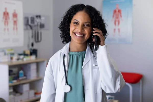 Portrait Happy Biracial Female Doctor Talking Smartphone Doctor Office Hospital — Stock Photo, Image