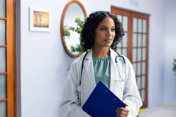 Biracial Female Doctor Wearing Stethoscope Holding Clipboard Doctor Office Hospital — Stock Photo, Image
