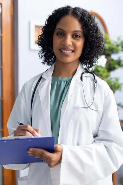 Portrait Happy Biracial Female Doctor Holding Clipboard Smiling Doctor Office — Stock Photo, Image