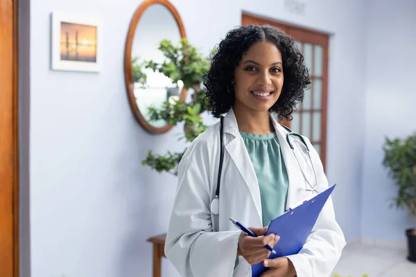 Portrait Happy Biracial Female Doctor Holding Clipboard Doctor Office Hospital — Stock Photo, Image