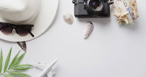 Close Hat Sunglasses Camera Seashells Plane Model White Background Copy — Stock Photo, Image