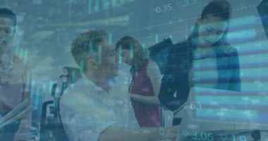 Animation of financial data processing over diverse business people in office. Global business, finances, computing and data processing concept digitally generated video.