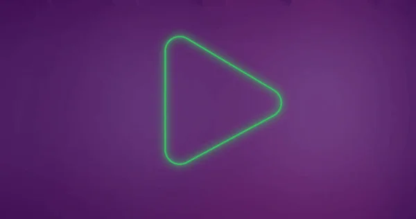 Composition of play button icon on purple background. Social media and digital interface concept digitally generated image.