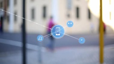 Animation of network of connections with icons over cityscape. Global business, finances, computing and data processing concept digitally generated video.