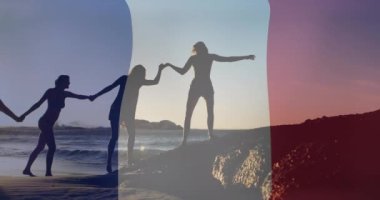 Sahildeki çeşitli arkadaşlara karşı Fransa bayrağı animasyonu. Fete nationale francaise, vatanseverlik ve dijital olarak üretilen kutlama konsepti.