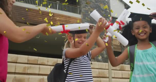 Animation Gold Confetti Celebrating Diverse Schoolgirls Mortar Boards Diplomas School — Stock Video