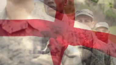 İngiliz bayrağının animasyonu, çeşitli erkek askerlerin silahlarıyla hazır beklemeleri üzerine. Küresel vatanseverlik ve askeri konsept, dijital olarak üretilen video.