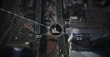 Animation of network of digital icons over spinning globe against aerial view of cityscape. Global networking and business technology concept