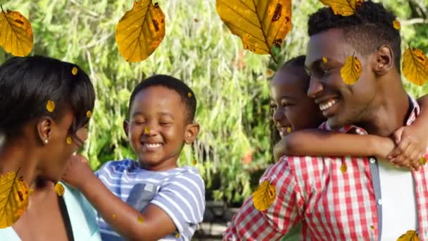 非洲裔美国家庭上空飘落的黄色叶子的动画 家庭和花时间在一起概念数码视频生成 — 图库视频影像