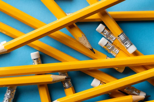 Close Stack Yellow Pencils Erasers Blue Background Writing Drawing Learning — Stock Photo, Image