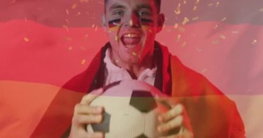Kafkasyalı futbolcunun üzerine düşen konfeti animasyonu Alman bayrağıyla kutlanıyor. Spor, rekabet, kazanma ve kutlama konsepti dijital olarak oluşturulmuş video.