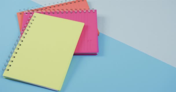 Overhead View Colourful Notebooks Blue Background Slow Motion Stationery Learning — Stock Video