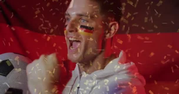 Animacja Konfetti Spadającego Białego Piłkarza Świętującego Niemiecką Flagą Koncepcja Sportu — Wideo stockowe