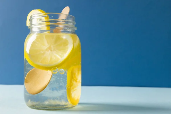 Close Mason Jar Lemonade Lemon Slices Table Blue Background Copy — Stock Photo, Image