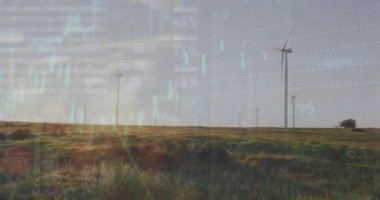 Çayırlarda gri gökyüzüne karşı dönen yel değirmenlerinin istatistiksel veri işleme sistemi. İş verileri ve yenilenebilir enerji teknolojisi kavramı