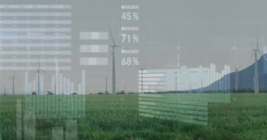 Çayırlarda gri gökyüzüne karşı dönen yel değirmenlerinin istatistiksel veri işleme sistemi. İş verileri ve yenilenebilir enerji teknolojisi kavramı