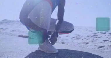 Koşan bir Afro-Amerikan adamın ayakkabı bağlama hareketinin animasyonu. Küresel bağlantılar, refah, zindelik ve dijital olarak üretilen sağlıklı yaşam tarzı konsepti.