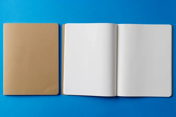 Close Beige Notebook Open Book Copy Space Blue Background Literature — Stock Photo, Image