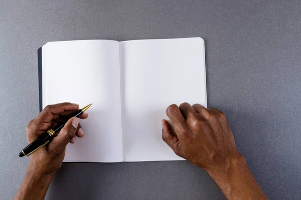 Hands Biracial Man Holding Pen Writing Notebook Copy Space Grey — Stock Photo, Image