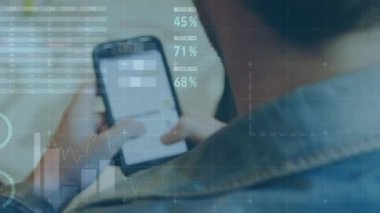 Animation of financial data processing over caucasian businessman using smartphone. Global business, finances, computing and data processing concept digitally generated video.