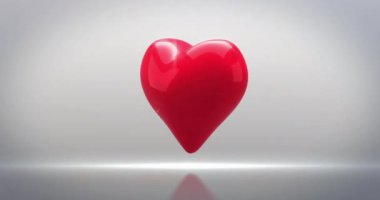 Gri arkaplanda dönen kalp ikonu animasyonu. Aşk, romantizm ve sevgililer günü konsepti dijital olarak oluşturulmuş video.