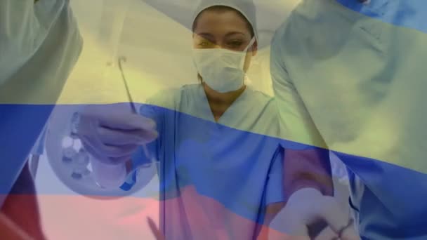 Animatie Van Zwaaien Colombia Vlag Team Van Diverse Chirurgen Uitvoeren — Stockvideo