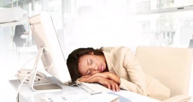 Animation of sleeping biracial businesswoman in office over people walking and cityscape. Global business, finances, digital interface, computing and data processing concept digitally generated video.