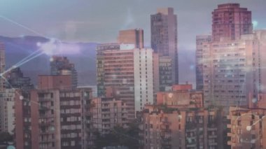 Animation of network of connections against aerial view of cityscape. Global networking and business technology concept