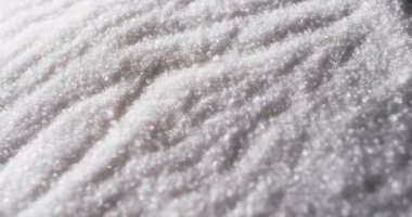 Video of close up of white sand grains with pattern and copy space background. Sand, texture and pattern concept.