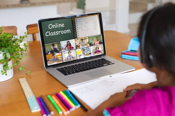 Biracial Girl Wearing Headphones Attending Online Class Video Call Laptop — Stock Photo, Image