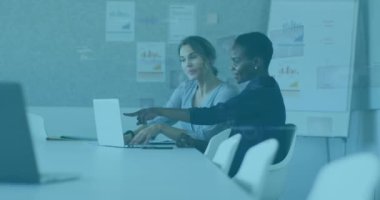 Animation of data processing over diverse business people in office. Global business, finances, computing and data processing concept digitally generated video.
