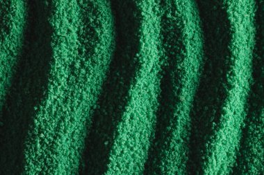 Yeşil kum desenini kapat ve uzay arkaplanını kopyala. Kum, doku, hareket, şekil ve renk kavramı.