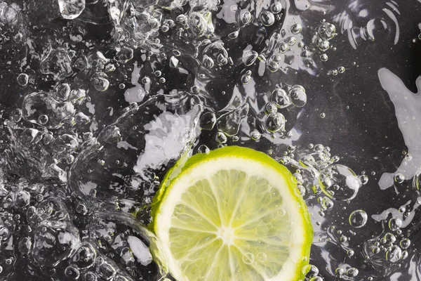 Close Lime Slice Water Copy Space Black Background Fruit Vegan — Stock Photo, Image