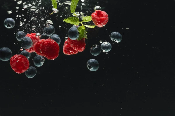 Close Fresh Berries Falling Water Copy Space Black Background Fruit — Stock Photo, Image